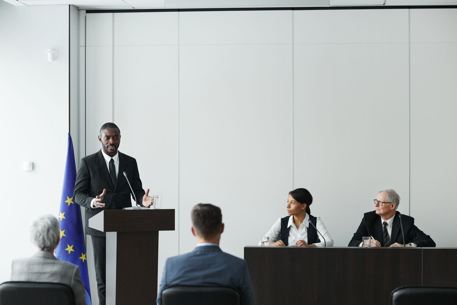 Public-sector leaders participating in a formal policy conference